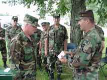 Doug Morrison being presented autographed 2000 Interservice Rifle Championships coffee cup by USAR Service Rifle Team after winning the individual championship.